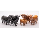 A group of Beswick cattle comprising an Aberdeen Angus cow,