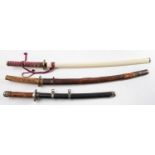 A Katana style sword, the single edged blade with brass habaki and tsuba,