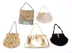 An early 20th century beadwork evening bag and four others.
