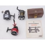 An Abu Ambassadeur 6000 C Multiplier reel in leather case with accessories and instruction booklet,