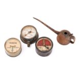 A circular brass signal indicator, together with a black lacquer cased signal indicator,