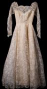 A mid 20th century lace and satin long-sleeve wedding dress in original retailer's box 'Rockheys