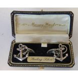 A pair of silver cuff links, stamped marks, in the form of fouled anchors, cased.