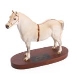 A Beswick Connoisseur model 'Champion' Welsh Mountain pony Gredington Simwnt 3614, on a wooden base,