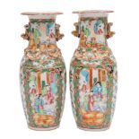 A pair of Canton baluster vases with applied gilt lion dog handles,