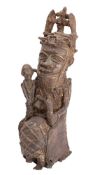 A Benin, West African, bronze statue of a seated Oba figure in traditional costume, 31cm high.