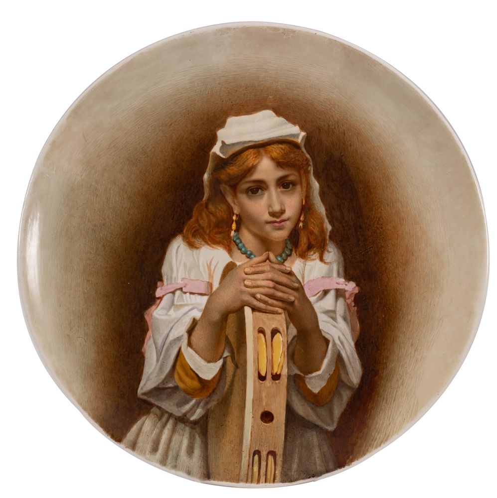 A pottery charger, probably Kensington Gore, hand painted with a female musician,