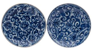 Two Chinese blue and white saucer dishes, Kangxi painted with scrolling lotus designs,