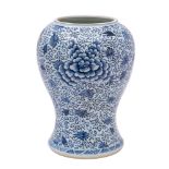 A Chinese blue and white yen yen vase [reduced] painted overall with a design of scrolling peony,