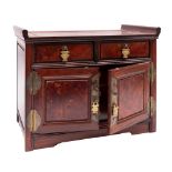 A Chinese burwood table cabinet with two upper drawers and three below enclosed by panelled drawers,