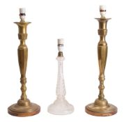 A near pair of brass table lamps modelled as candlesticks in 18th century style,