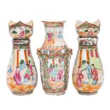 A pair of Canton vases and one similar, Qing Dynasty the pair with lotus petal rims,