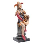 A Royal Doulton figure, The Jester HN.1702, together with a wooden base.