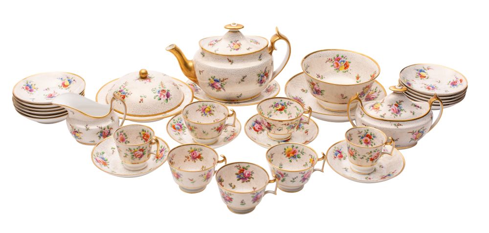 An extensive Spode porcelain part tea service painted with floral sprays and sprigs on a gilt dot