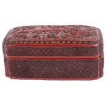 A Chinese cinnabar lacquer box and cover of shaped rectangular form the cover carved with scholars