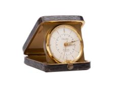 Chandler, a small Edwardian snake skin travelling clock the round dial with baton numerals,