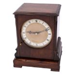 A late-20th century mahogany mantel clock having an eight-day duration single-fusee timepiece