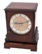 A late-20th century mahogany mantel clock having an eight-day duration single-fusee timepiece