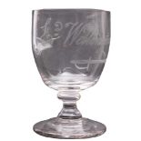 A small toasting glass, the oviform bowl engraved with a sword and the caption 'Ld.