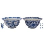 Two Chinese blue and white 'klapmuts' bowls, Kangxi the first painted with prunus blossom,