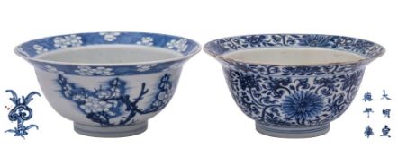 Two Chinese blue and white 'klapmuts' bowls, Kangxi the first painted with prunus blossom,