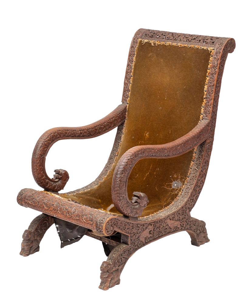 An Anglo Burmese carved hardwood and upholstered 'planter's chair',
