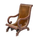 An Anglo Burmese carved hardwood and upholstered 'planter's chair',
