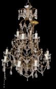 A metal and cut glass hung twelve light chandelier in Louis XV taste; 20th century;