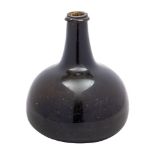 A transitional/mallet form wine bottle of green amber hue with raised neck,