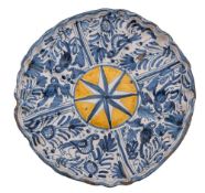 An Italian maiolica tazza with wide moulded rim,