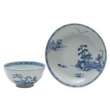 A Chinese 'Nanking Cargo' blue and white porcelain saucer dish and a similar bowl both painted with