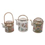 A group of three Canton teapots and covers of cylindrical form with flattened covers and rattan