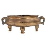 A Chinese bronze censer of quatrefoil form with stylised elephant head handles and embellished with