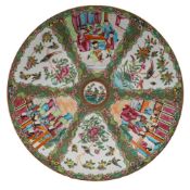 A Canton charger with small central bird and flower medallion within six fan-shaped panels,