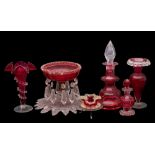 A mixed group of cranberry glass, comprising a footed bowl hunt with pendants, two vases,