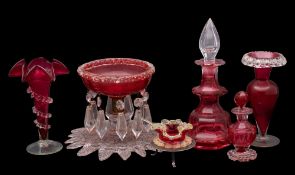 A mixed group of cranberry glass, comprising a footed bowl hunt with pendants, two vases,