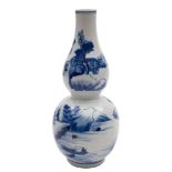 A Chinese blue and white double gourd vase painted with mountainous lake landscapes with buildings