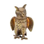 A Sri Lankan brass and glass-inset model of a long-eared owl, 20th century, modelled standing,