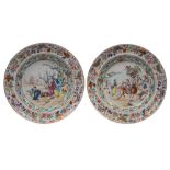 A pair of Canton plates finely enamelled, one with a scholar, attendants, a crane and plum trees,