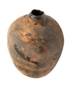 A Mediterranean terracotta oil or wine bottle.