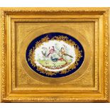 A pair of Sèvres-style porcelain oval plaques each painted with exotic birds in a garden reserved