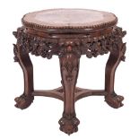 A Chinese carved hardwood and marble mounted stand, late 19th century; of lobed circular section,