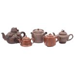 Five Chinese Yixing teapots, one in the form of the seated immortal Li Tieguai,