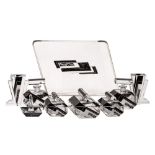 An Art Deco clear glass dressing table set, comprising a trapezoidal tray,