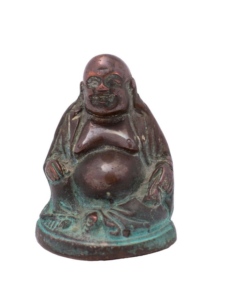 A small Chinese copper alloy figure of Budai in traditional smiling pose, 6.5cm.