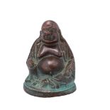 A small Chinese copper alloy figure of Budai in traditional smiling pose, 6.5cm.