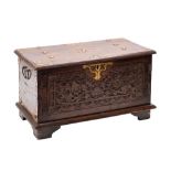 A South East Asian carved and stained hardwood and metal mounted coffer,