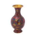 A Chinese cloisonne enamel vase of ovoid form with all-over floral decoration to wine red field, 15.