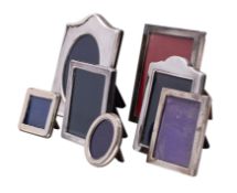 Seven small silver easel photograph frames, various sizes, dates and makers.
