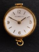 Gubelin, a small round fob watch the dial with raised baton numerals,